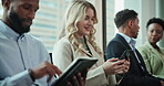 Technology, people and waiting room in row for job interview at office with research, internet and conversation. Candidate, hiring process and smile for recruitment, career opportunity and prepare