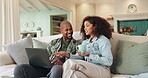 Happy, couple and relax with laptop at house for communication, surfing social media and streaming online. Smile, black people and digital with coffee for bonding, reading news and entertainment app