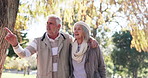 Happy, walking and senior couple in park for bonding, relationship and relax together. Love, retirement and mature man and woman outdoors together for wellness, health and commitment in nature