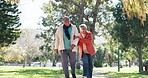 Happy, walking and senior couple in park for bonding, relationship and relax together. Love, retirement and mature man and woman outdoors together for wellness, health and commitment in nature