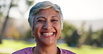 Smile, nature and portrait of mature woman with confidence for retirement, vacation and outdoor exploring. Happy, face and elderly female person from New York in park for holiday, tourism and peace