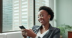Laughing, black woman and relax with phone in office for communication, networking and social media meme. Smile, female person and mobile for funny joke, browse internet and reading comic website