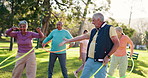 Senior people, exercise and nature with hula hoop for class, fun workout or elderly care in fitness. Happy or mature group talking with toy for movement, balance or funny acitivity together at park