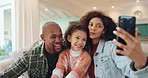 Comic, funny face and selfie with family in living room of home together for bonding, comedy or humor. Joke, laughing or love with portrait of mother, father and daughter in apartment to relax