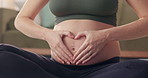 Yoga, heart and hands of pregnant woman with care, prenatal love and relax for healthy body. Pilates, pregnancy and mother touch stomach for future maternity, fitness and connection with baby in home