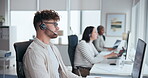 Call center, computer and man with headset in office for customer service, online advice or telemarketing. Help, contact us and consultant in discussion for communication, assistance or tech support