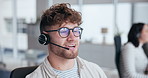 Callcenter, talking and man with headset in office for customer service, online advice or telemarketing. Help, contact us and consultant in discussion for communication, assistance or tech support 