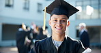 Happy man, student and graduation with degree at university for education, learning or qualification at campus. Portrait of young male person or graduate with smile for certificate or scholarship