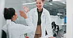 Science, laboratory and women high five on computer for research, medical breakthrough and study results. Healthcare, pharmaceutical and scientist celebrate for discovery, experiment and teamwork