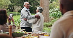 Senior, couple and dancing in garden with marriage at family reunion for celebration with fun. Happy woman, video and smile with social media post, care and love at anniversary party and event