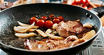 Cooking, steak and pan in restaurant with frying, vegetables and herbs for taste of food or meal prep in hotel. Cuisine, gas stove and meat for fine dining with culinary skills, luxury beef and fries