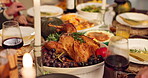 Food, thanksgiving and hands with turkey, wine and table setting for reunion, celebration and holiday. Family gathering, people and dinner for gratitude and social with gourmet meal, event or feast
