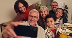 Happy family, dining and food with selfie for thanksgiving, memory or photography together at home. Grandparents, parents and children with smile for group picture, moment or bonding at dinner table