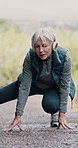 Outdoor, stretching and senior woman with headphones, fitness and training with retirement. Old person, outside and pensioner with headset, wellness and exercise with hobby, activity and healthy lady