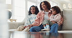 Mother, children and watching comedy in home, laughing and funny humor or tv for bonding. Mom, daughter and girl for series or cartoon movie, relax and kids for security in relationship or support