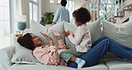 Mom, child and hand game on sofa for fun bonding, relax together and love relationship in home. Mother, young girl and play in living room with clapping for high five, family connection and support