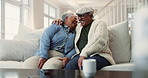 Senior, couple and hug with laughing on sofa for funny joke, marriage, or commitment in retirement. Elderly, people and happy in home with embrace, love or talking in living room for bonding or relax