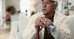 Senior man, hands and thinking with cane for mobility, support and healthcare in living room. Handkerchief, walking stick and lonely person with disability for arthritis, assistance or memory on sofa