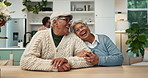 Senior couple, together and laugh in home for funny conversation, bonding and care with love. Elderly man, woman and happy in dining room with silly discussion for comedy joke, relax and retirement