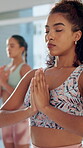 Meditation, women and yoga fitness at gym for spiritual healing, breather exercise and mindfulness of health. People, pilates and zen practice of calm performance, holistic care and wellness class