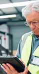 Man, engineer and browsing tablet at warehouse for machine inspection with checklist for safety. Mature person, manager and logistics at factory for distribution, supply and production at storehouse