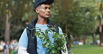 Volunteer, thinking and man with plant in forest for community service, project and sustainability. Environment, ecology and person with leaves in nature for NGO outreach, eco friendly and gardening