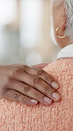 Hands, shoulder and nurse with elderly person in nursing home for care, support and kindness. Retirement, healthcare and closeup of caregiver with patient for comforting, empathy and counselling