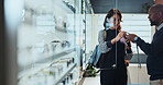 Woman, optometrist and decision for eye care, consultation and optometry with shopping retail frame. Female person, spectacles and option in clinic or ophthalmology center for size, glasses and lens