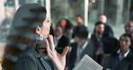 Business woman, speaker and meeting with team in seminar for corporate training, mission or goals at office. Female person or executive discussing company strategy to group of employees at conference