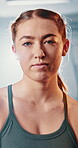 Face, athlete and woman in gym, fitness and confident of routine in morning, workout and training. Club, healthy and portrait of person, exercise and commitment for muscle, proud and goal for sports