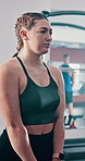 Woman, active and kettlebell for fitness at gym with breathing exercise, resilience training or strong muscle. Female athlete, equipment and weightlifting for workout, performance and sport challenge