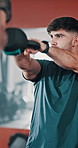 Weight, swing and man in gym for strength workout, training or body building for fitness. Sports, active and male athlete with kettlebell for muscles, power and bicep exercise in health center.