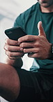 Hands, man and gym for fitness on smartphone with internet  for exercise, training and workout video. Male person, body builder and texting on social media with tips for healthcare and wellness