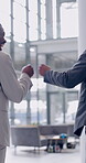 Business people, men and fist bump greeting in office for goodbye, productivity and handshake at workplace. Professional, employees or hand gesture in work building for congratulations or achievement