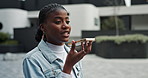 Black woman, loudspeaker and phone call in city, communication and conversation. African person, outdoor and happy girl with smartphone, technology and discussion with survey, travel and commute
