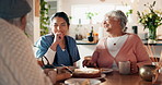 Assisted living, cake and nurse with senior couple for dessert or visit in retirement home together. Eating, food or funny with caregiver, old man and woman laughing in dining room of apartment