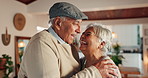 Old couple, laugh and funny conversation in home, support and hug for comfort in living room. Elderly people, safety embrace and humor for retirement romance, talking and whisper joke to husband