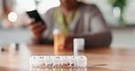 Senior woman, pill box and medication for weekly dose with telehealth in home for retirement. Elderly, female person and pharma for reading in lounge for wellness, diabetes and treatment as pensioner