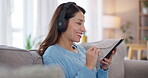 Woman, texting and music on earphones with mobile phone, living room and happiness for communication in home. Girl, technology and singing on streaming service, online playlist and ai software in app