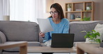 Woman, hands and laptop for business email on living room table sitting on sofa at home. Creative female employee, remote work and computer for online research, project proposal or idea document