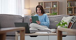 Home, woman and tablet with typing, internet and research with social media in lounge. Person, apartment or girl on couch with technology, digital app or connection with online information or network