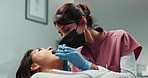 Dentist, woman patient and dental excavator with teeth exam for orthodontics check in healthcare consultation. Cleaning, assessment and inspection for oral hygiene and mouth wellness in clinic