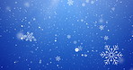 Christmas, particles and snowflakes on blue background space for digital card, creativity and festive season. Snow animation, bokeh spots and glitter on wallpaper for texture, sparkle and celebration