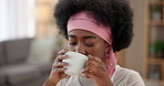 Happy black woman, relax and drinking with coffee for morning, calming beverage or breakfast at home. Young African or female person with mug of cappuccino for warm sip, caffeine or comfort at house