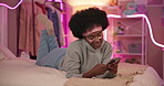 Home, typing and black woman with cellphone, bed and social media with message, internet and relax. African person, apartment and girl with smartphone, smile and online chatting with mobile user