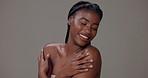 Black woman, glow and smile for skincare, treatment or cosmetics on gray studio background. Happy African model, face and satisfied with beauty, moisturizing and natural skin health for wellness