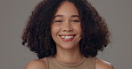 Portrait, haircare and woman with confidence, natural afro and smile on grey studio background. Face, happy model and satisfaction with cosmetic, salon grooming and keratin treatment for beauty glow