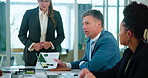 Meeting, documents and man with business people in discussion for planning, teamwork and project. Corporate office, collaboration and men and women with paperwork for feedback, review and talking