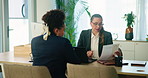 Business woman, meeting and interview with applicant for hiring, recruit or application at office. Female person, employer and candidate with resume, cv or document for job or career opportunity