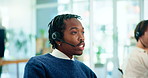 Black man, agent and call center with headphones for customer service or virtual assistance at office. Young African, male person or consultant talking with headset for online advice at workplace